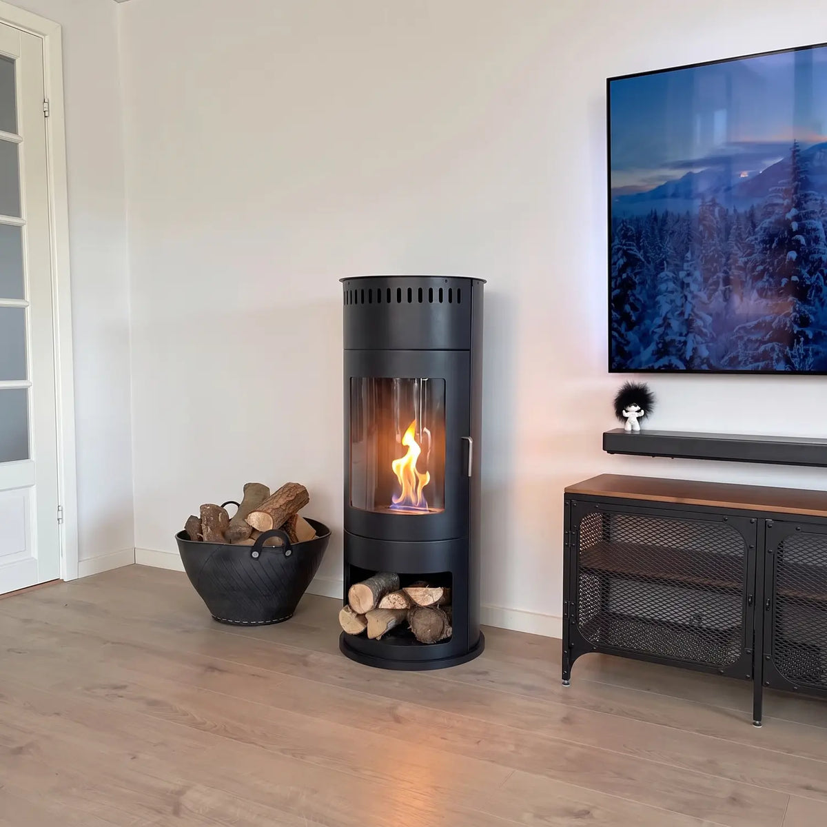 Washington black bioethanol stove lit in a living room beside a log basket and media console